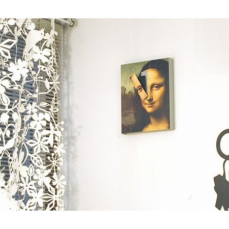 MONA LISA CLOCK Kikkerland